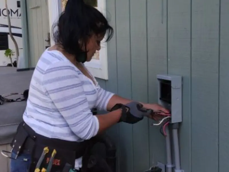 Licensed electrician wiring an exterior subpanel in Cottonwood